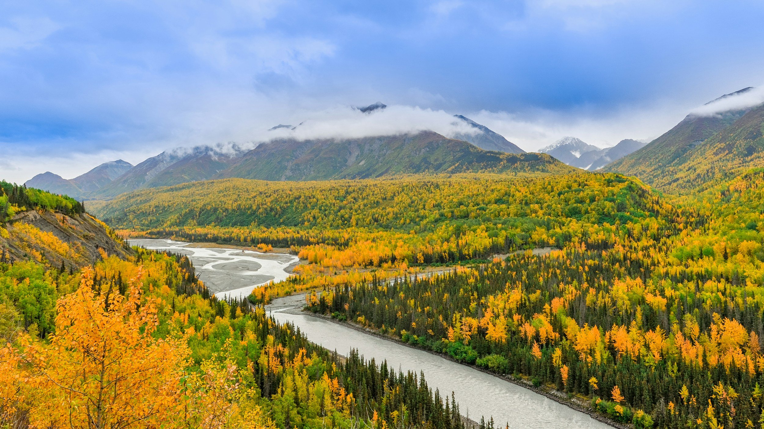 The city of Anchorage spread out beneath snow-dusted mountains in southcentral Alaska