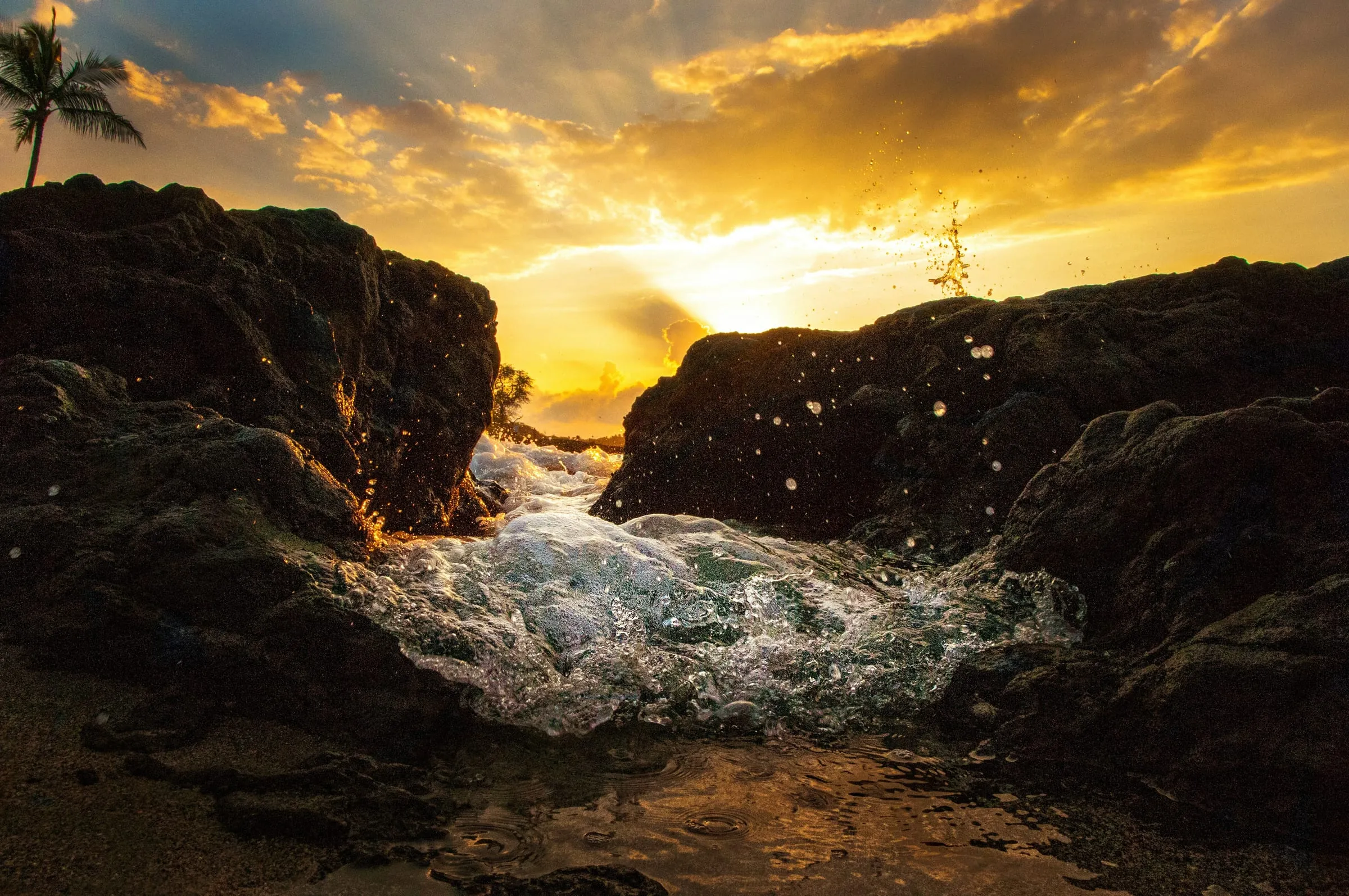 Black volcanic coastline meeting the Pacific on Hawaii's Big Island