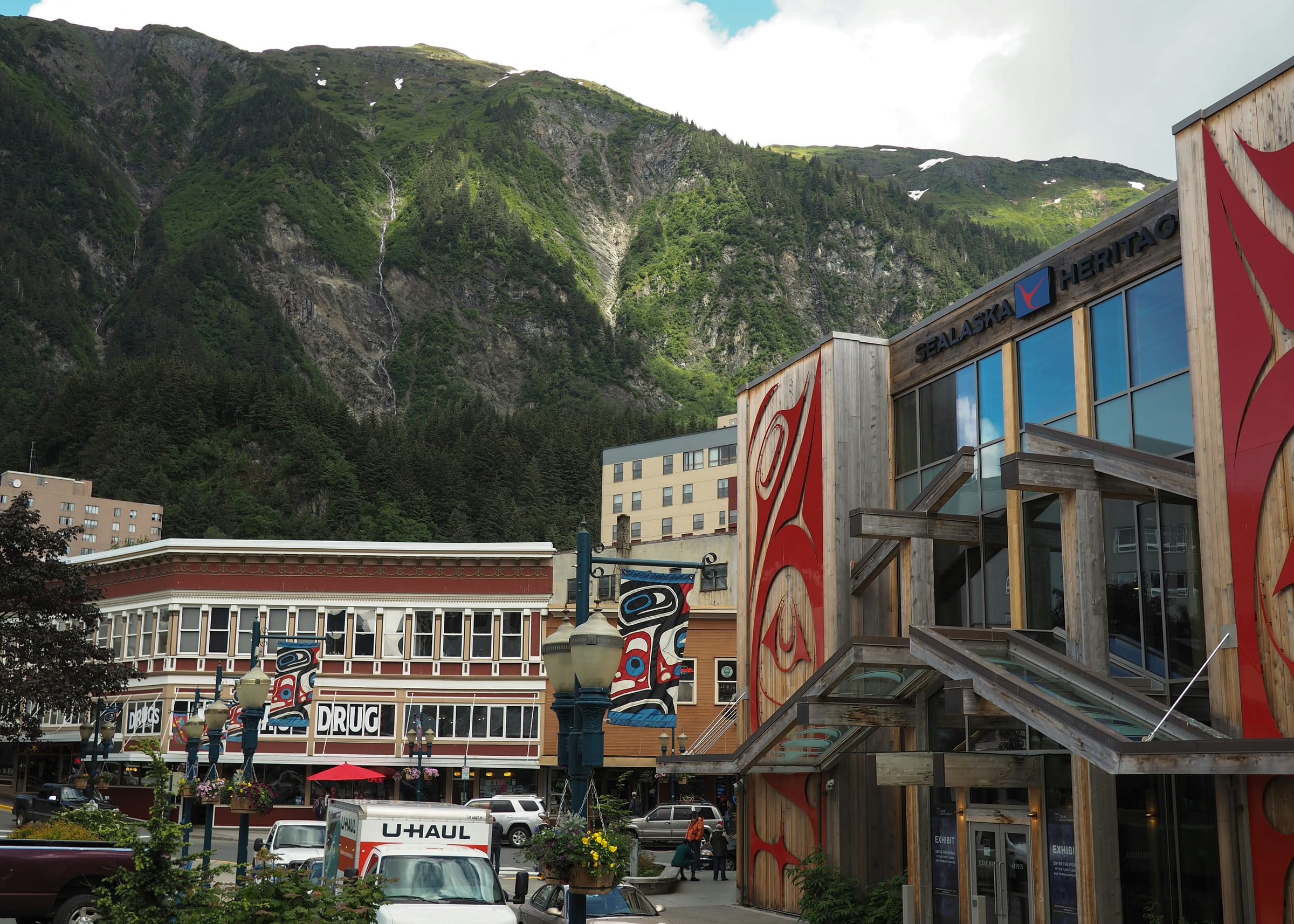 Forested mountains rising steeply above the waterfront of Juneau, Alaska