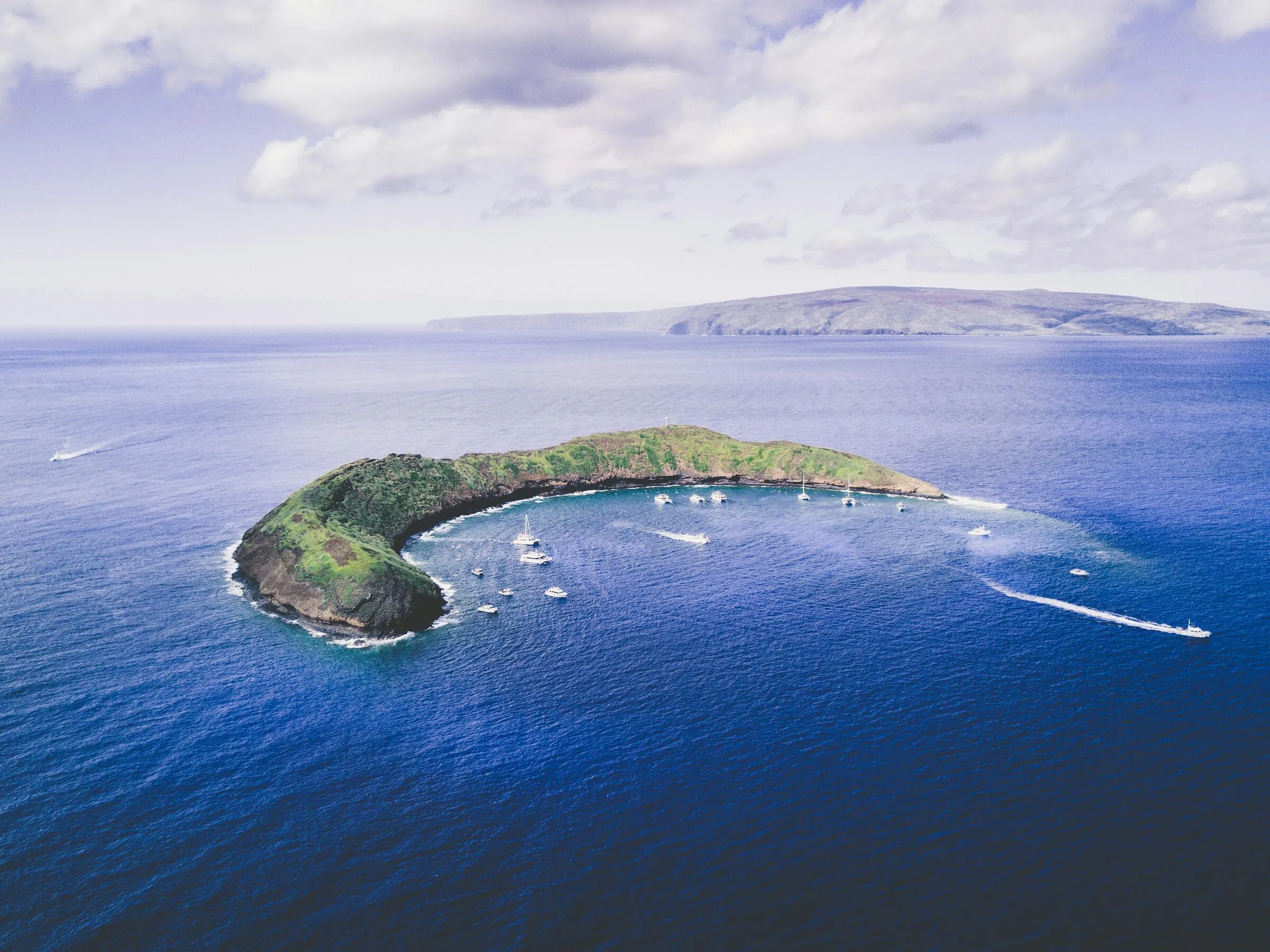 Towering green sea cliffs along the remote coastline of Molokai, Hawaii