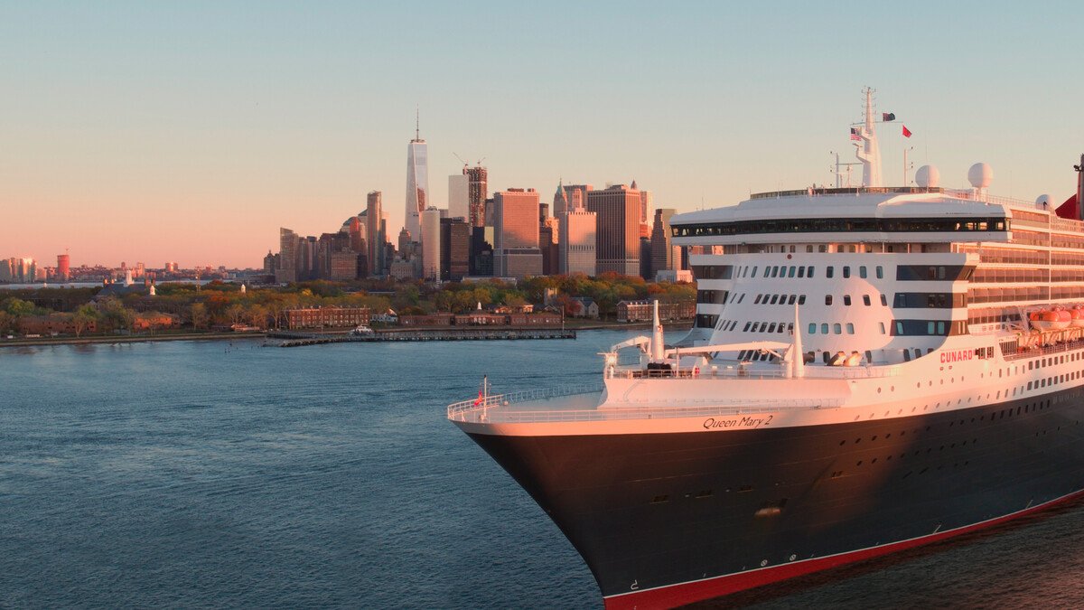 Queen Mary 2 departing New York harbour — Cunard's brand film still, treated black & white per the brand's ATL hero standard.