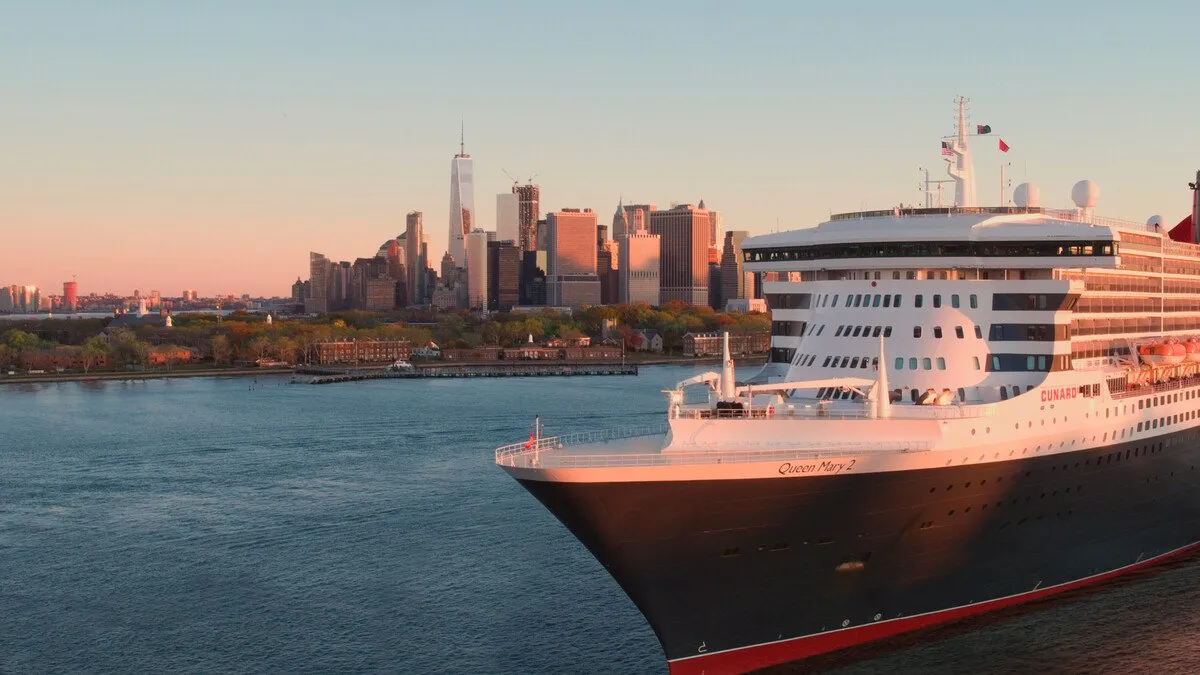 Cunard Queen Mary 2 departing New York at golden hour.