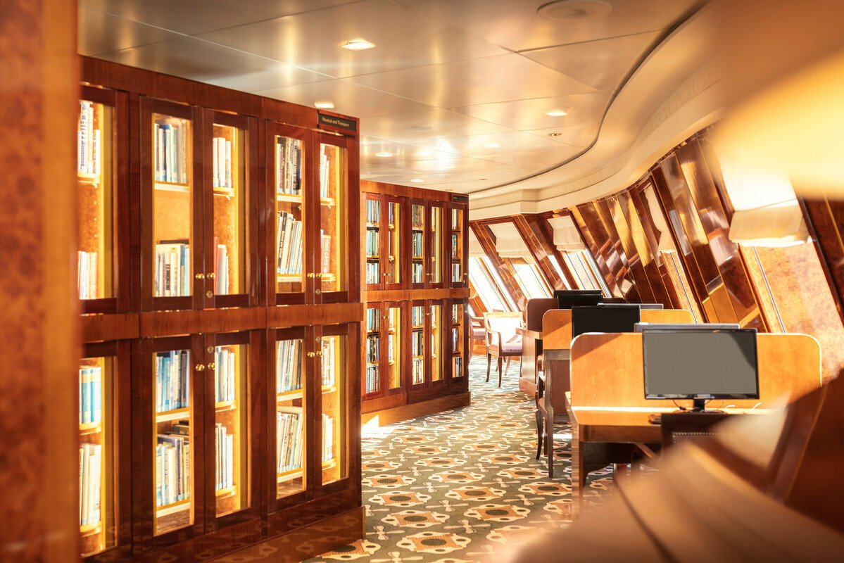 Queen Mary 2's library — the largest at sea, with over ten thousand volumes.