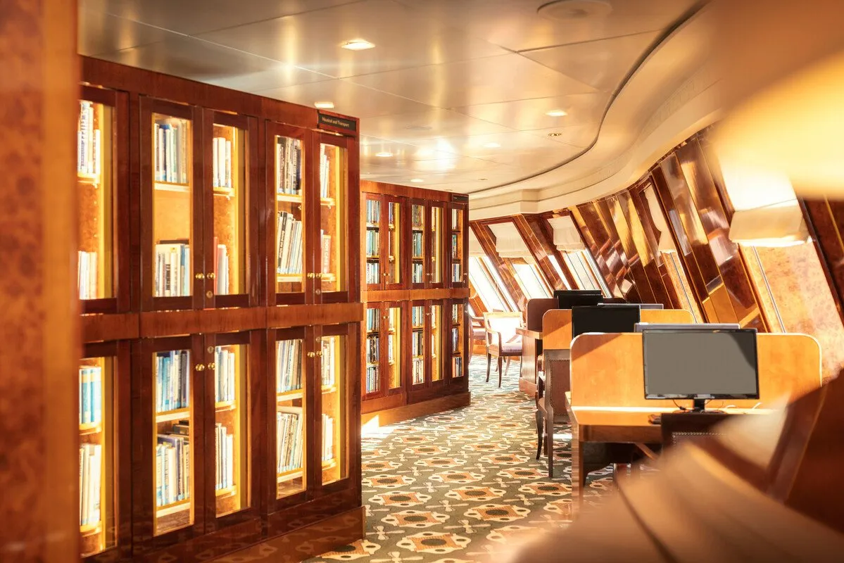 Queen Mary 2's library — the largest at sea, with over ten thousand volumes.