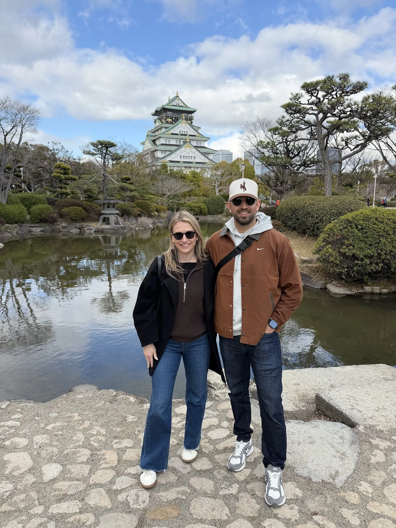 Madison and her husband at a Japanese castle and pond garden during their honeymoon.
